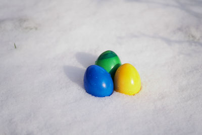 Close-up of colorful easter eggs on snow