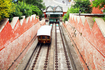 High angle view of train amidst buildings