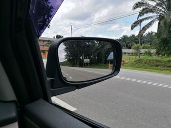 Close-up of side-view mirror of car