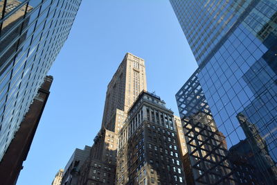 Low angle view of skyscrapers against sky