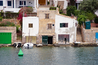 View of canal amidst buildings in city