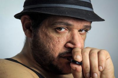 Close-up portrait of man against white background