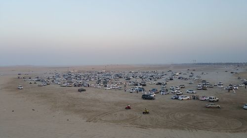 High angle view of crowd on shore against sky