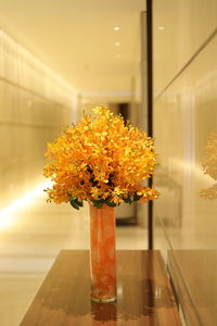 Close-up of yellow flowers in vase