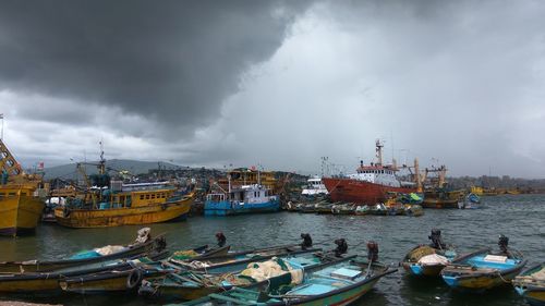 Boats moored at harbor