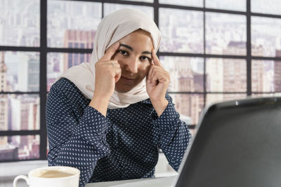 Young woman using phone