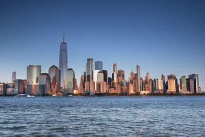 Modern buildings in city against clear sky