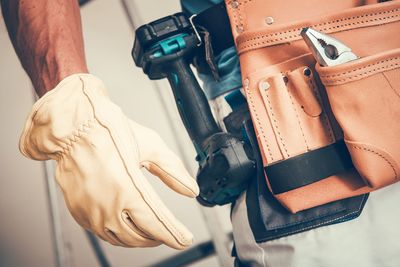 Midsection of manual worker working in workshop