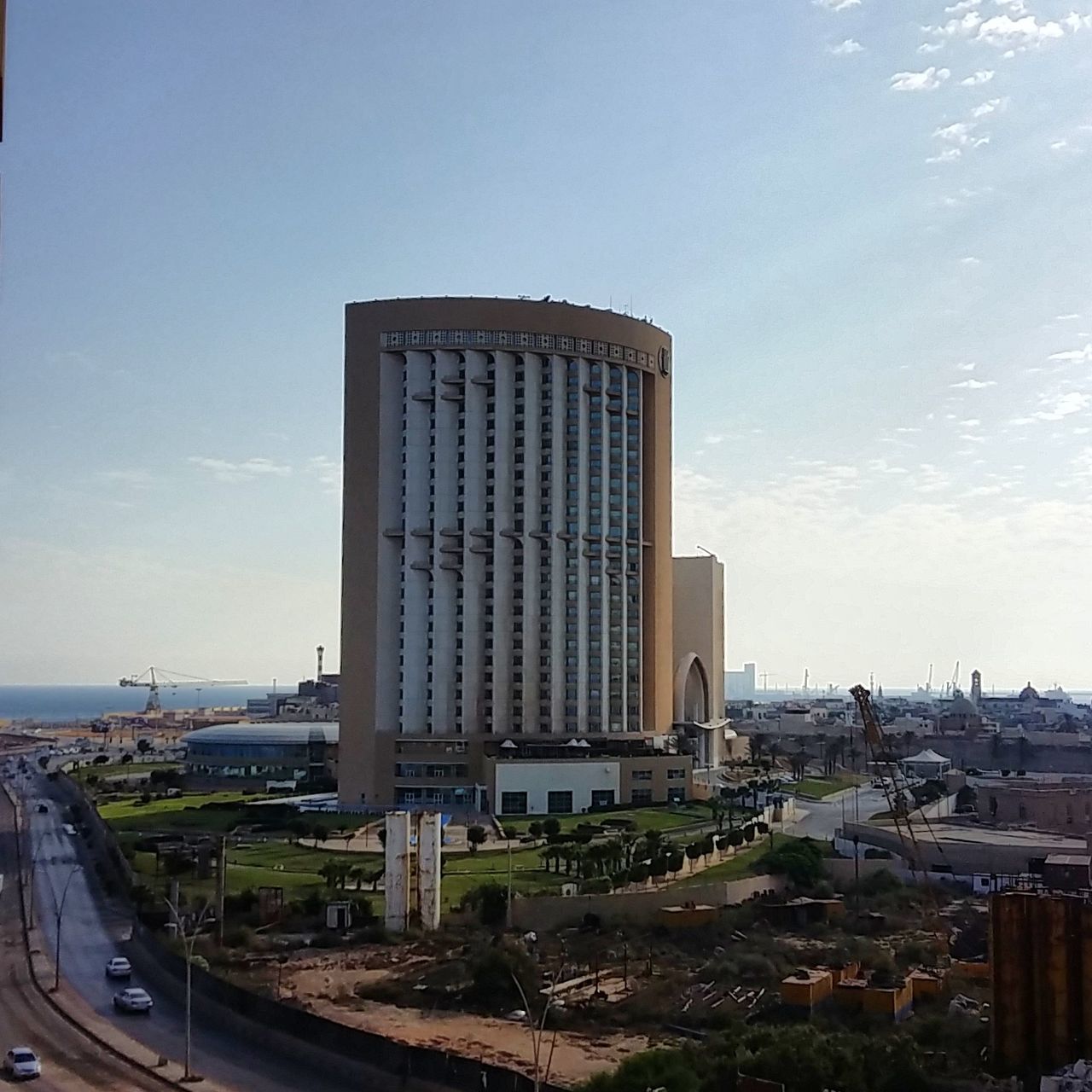 architecture, built structure, building exterior, sky, city, building, nature, no people, office building exterior, day, cloud - sky, skyscraper, cityscape, tower, tall - high, travel destinations, outdoors, modern, travel, office, architectural column