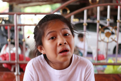 Close-up of cute girl looking away