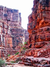 Low angle view of rock formations against sky