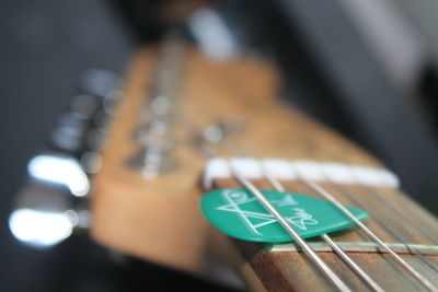 Close-up of guitar with pick