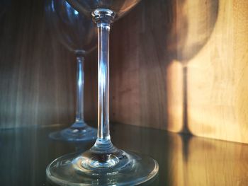 Close-up of water falling from glass on table