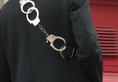 Arrest of a suspect with handcuffs by the police during an operation