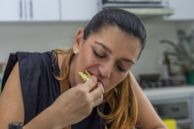 Portrait of woman eating food