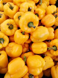 Full frame shot of yellow bell peppers for sale at market stall