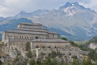 View of historic building against mountain range