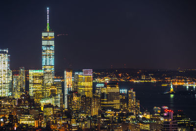 Illuminated buildings in city at night