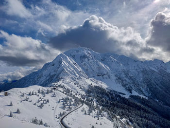 Scenic view of snowcapped mountains against sky