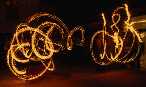 Fire dancers performing at night