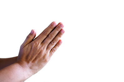 Close-up of person hand against white background