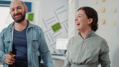 Smiling business colleagues at office