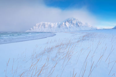 Scenic view of sea against sky during winter