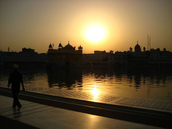 Reflection of sun in water at sunset