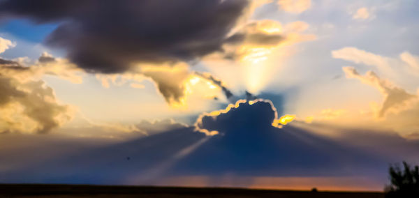 Low angle view of dramatic sky during sunset