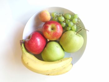 Close-up of apples on apple against white background