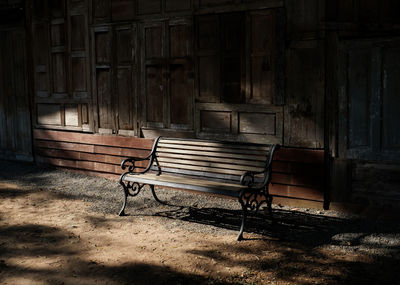 Empty bench in abandoned building