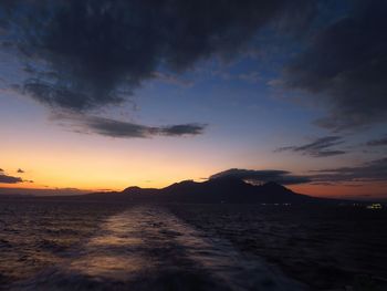 Scenic view of sea against sky at sunset