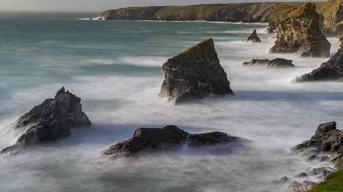 Scenic view of rocks in sea