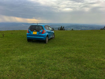 Car on land against sky