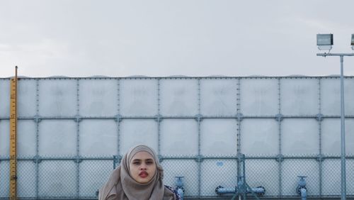 Portrait of young woman wearing hijab