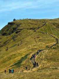 High angle view of people on field against sky