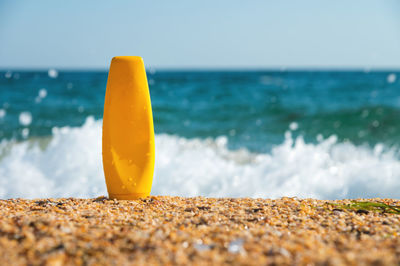 Close-up of red water on beach