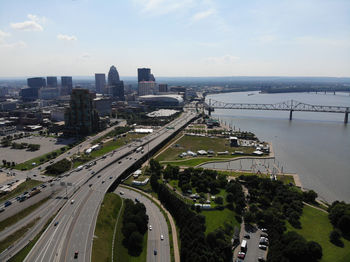 High angle view of road amidst buildings in city against sky