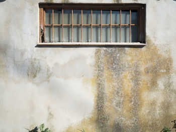 Low angle view of window on old building