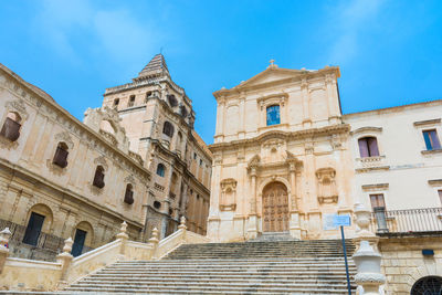 Low angle view of historical building against blue sky