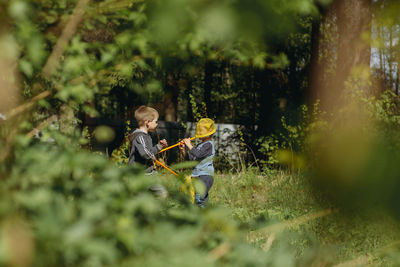 Little boys with butterfly nets in countryside. image with selective focus