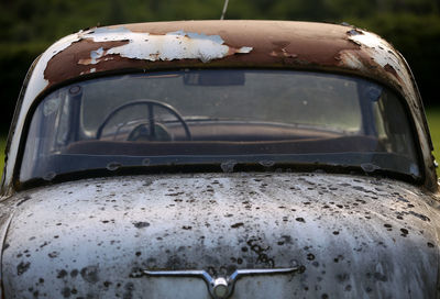 Close-up of abandoned car