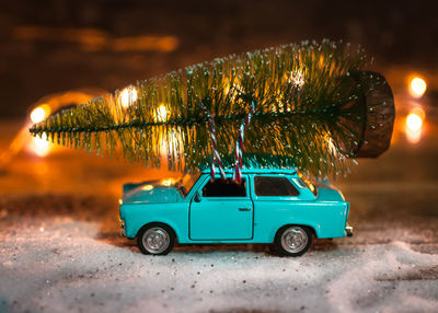 Christmas tree on vintage toy car. christmas concept