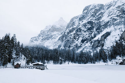 Scenic view of snow covered mountains against sky