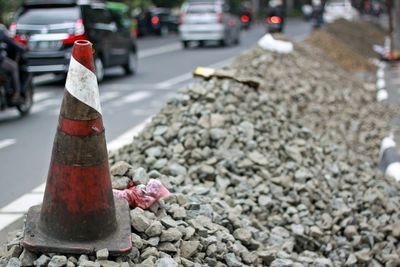 Close-up of red car on road