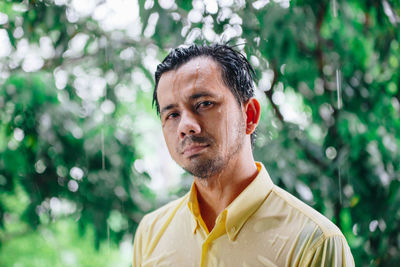 Portrait of man against plants