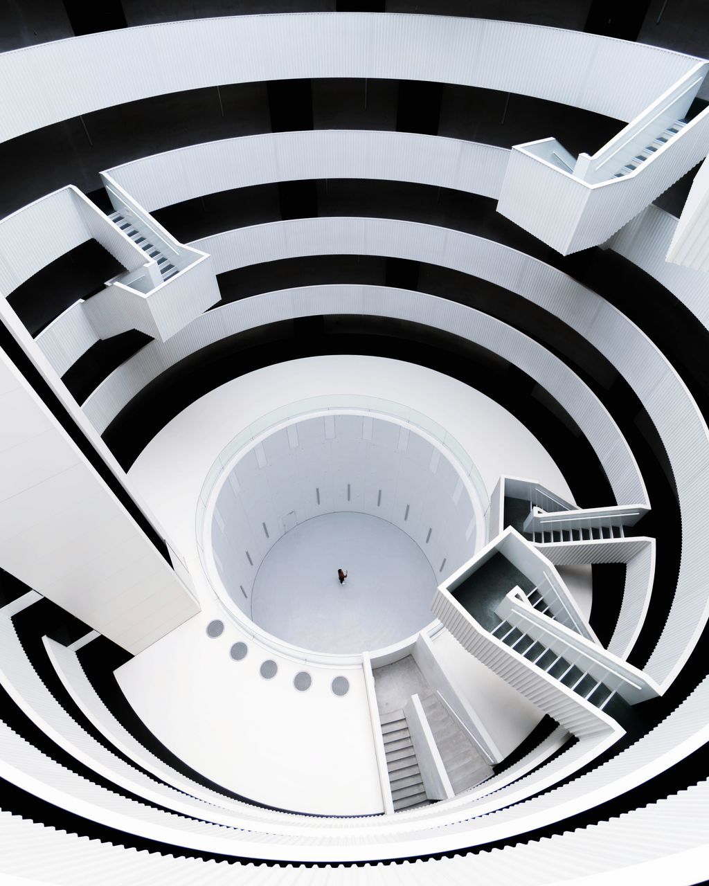 steps and staircases, staircase, indoors, pattern, spiral, architecture, spiral staircase, built structure, no people, high angle view, white color, design, railing, diminishing perspective, shape, geometric shape, modern, building, full frame, backgrounds, directly below, ceiling, concentric