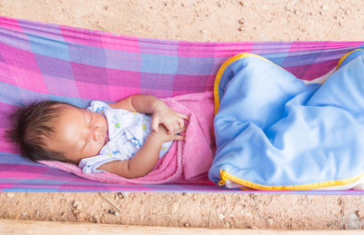 Cute baby sleeping on bed