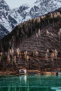 Scenic view of lake against mountain during winter