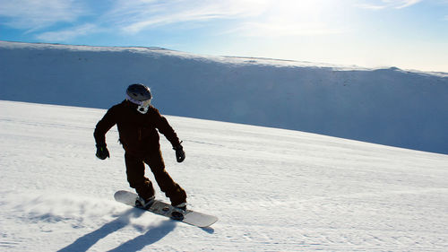 
snowboarding on the ski slope. healthy lifestyle, outdoor recreation on a winter day